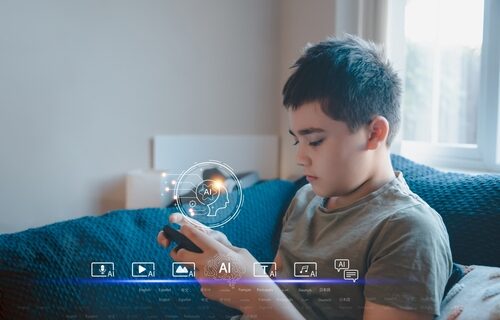 Kid,Boy,Learning,Multiple,Languages,With,Ai,On,Smartphone.,Concept